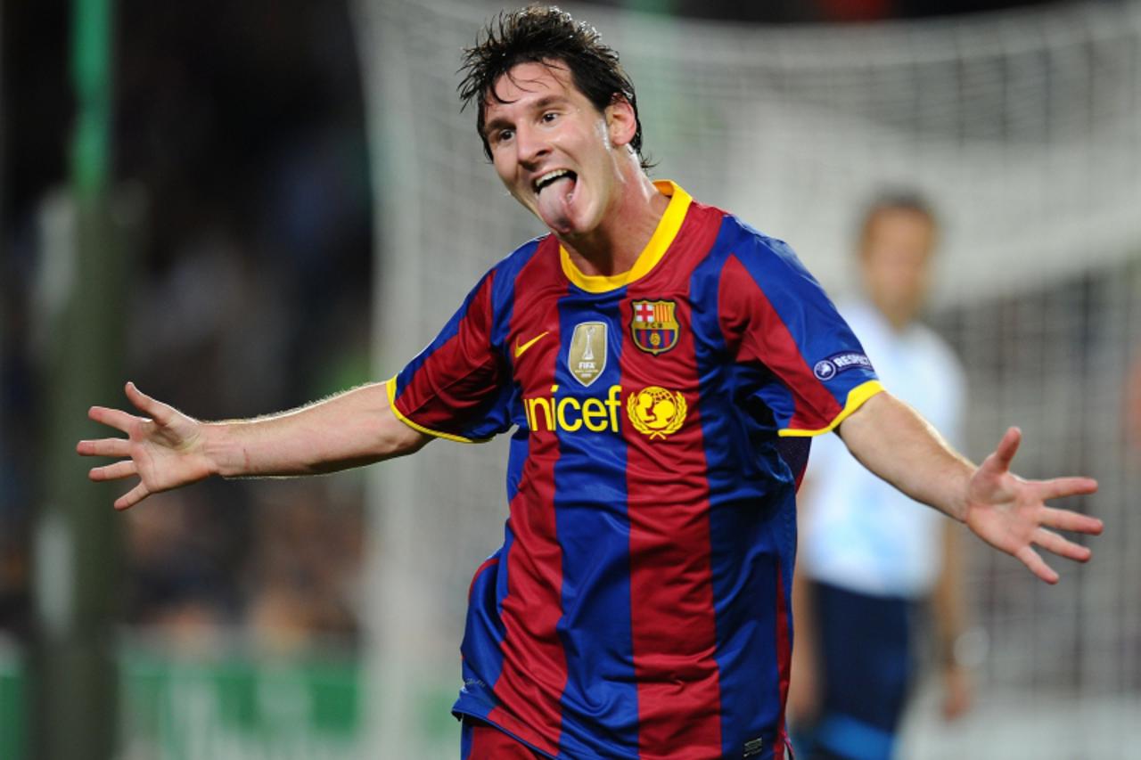 'Barcelona\'s Argentinian forward Lionel Messi celebrates after scoring during the UEFA Champions League football match Barcelona against Panathinaikos on September 14, 2010 at the Camp Nou stadium in