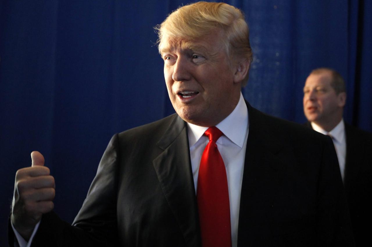 'REFILE - CORRECTING DATE    Businessman and reality TV personality Donald Trump speaks with reporters before endorsing Mitt Romney in the race for the 2012 Republican nomination in Las Vegas February