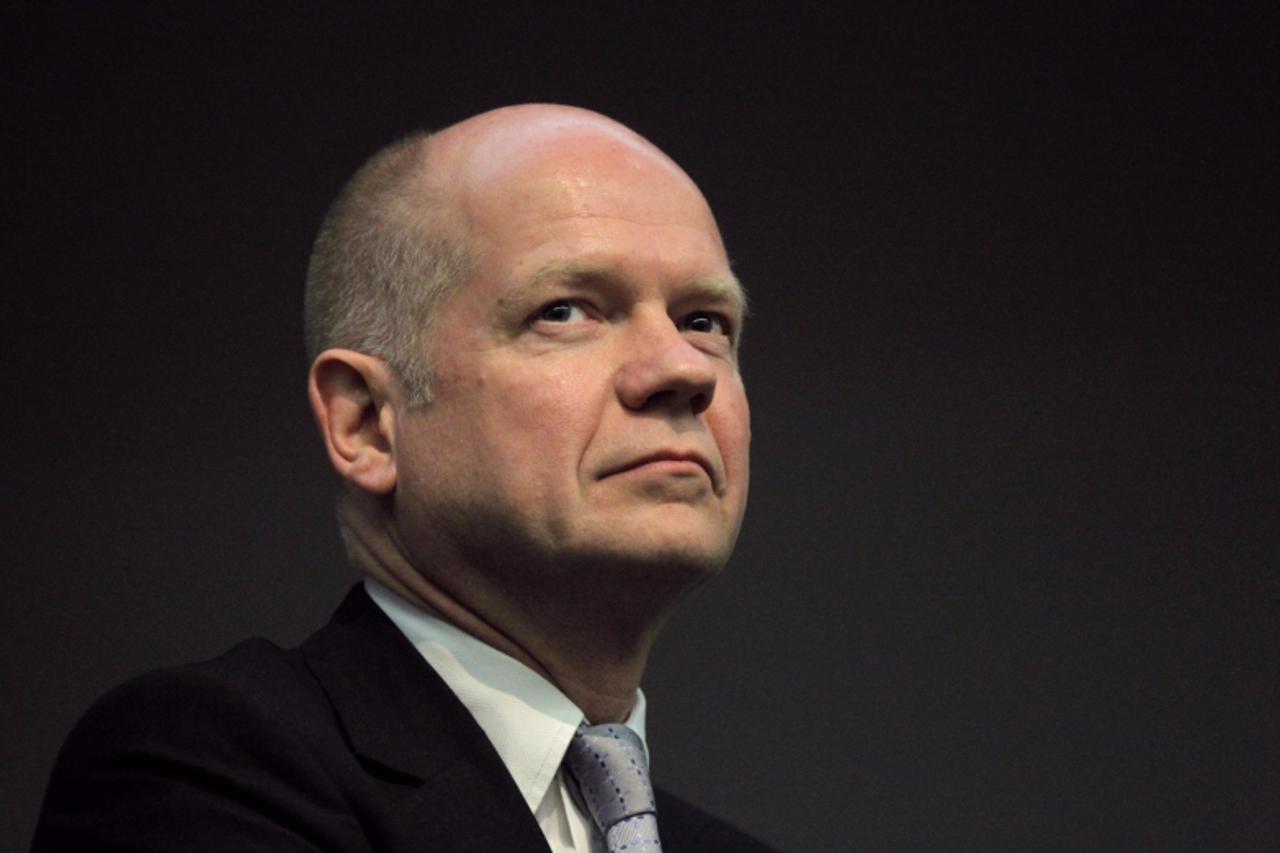 'British Foreign Secretary William Hague waits to address students and staff at the University of the Western Cape in Cape Town February 14, 2012. Hague is on a short official visit to the country. RE