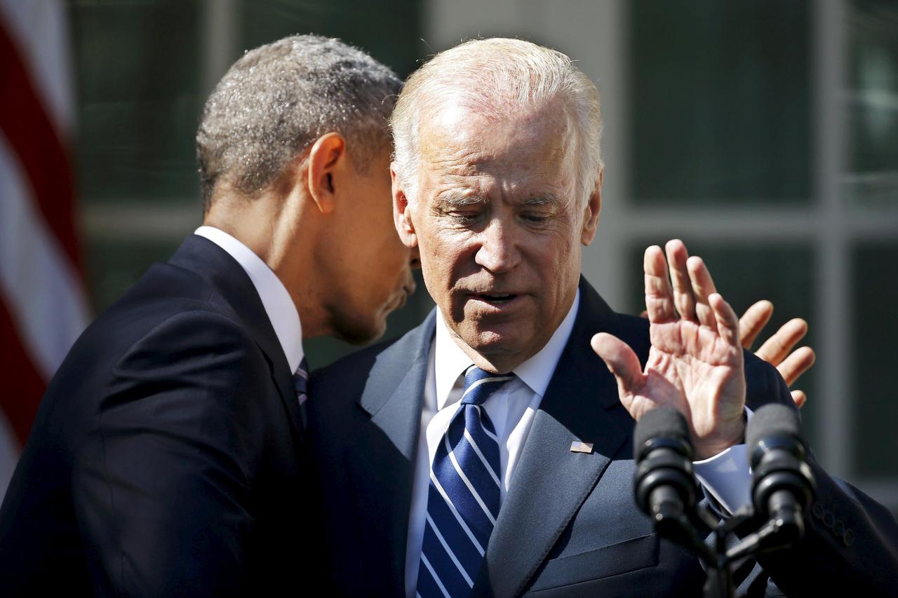 U.S. President Barack Obama hugs Vice President Joe Biden after Biden announced he will not seek the 2016 Democratic presidential nomination during an appearance in the Rose Garden of the White House in Washington October 21, 2015. REUTERS/Carlos Barria  