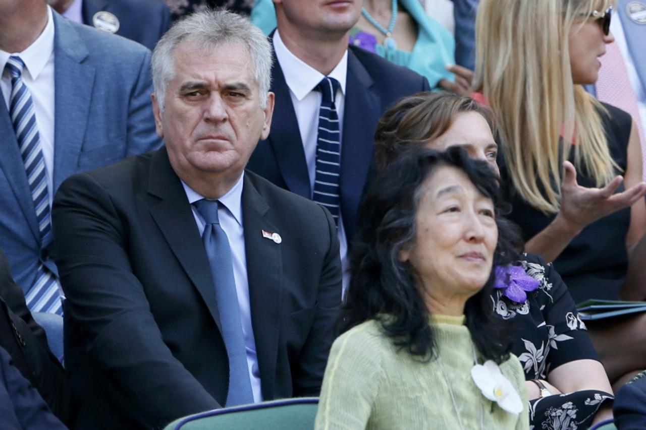 'Serbian President Tomislav Nikolic sits on Centre Court for the men\'s singles final tennis match between Andy Murray of Britain and Novak Djokovic of Serbia at the Wimbledon Tennis Championships, in