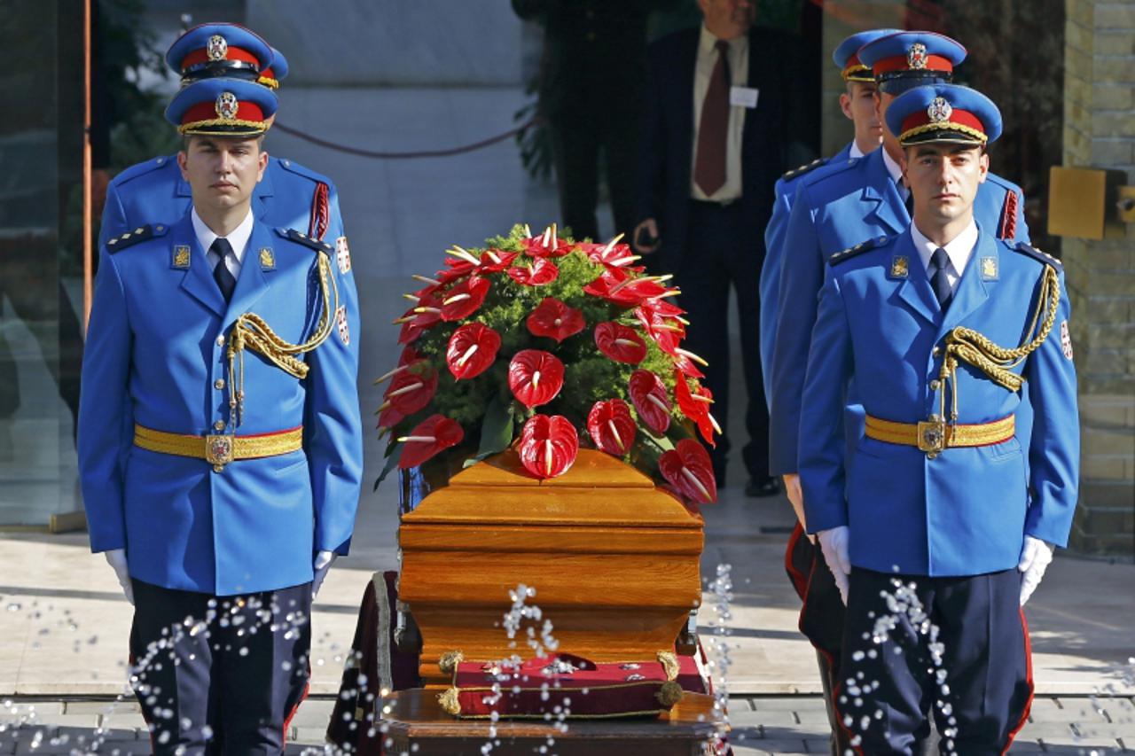 'A honour guard stands around the coffin of Jovanka Broz in front of the House of Flowers mausoleum where she will be buried next to her husband, former Yugoslav leader Josip Broz Tito, in Belgrade Oc
