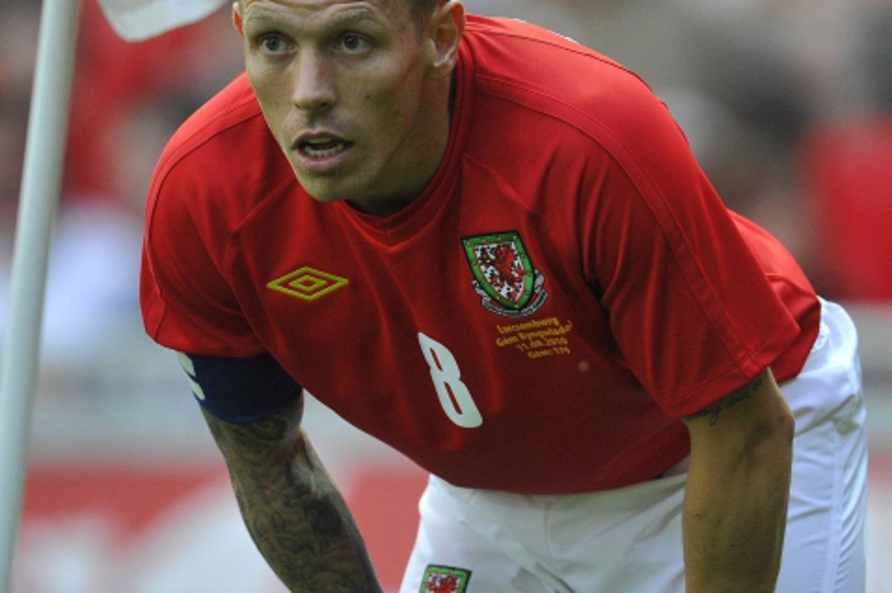 'Wales\' Craig Bellamy reacts during their international friendly soccer match against Luxembourg at Llanelli August 11, 2010. REUTERS/Toby Melville (BRITAIN - Tags: SPORT SOCCER)'