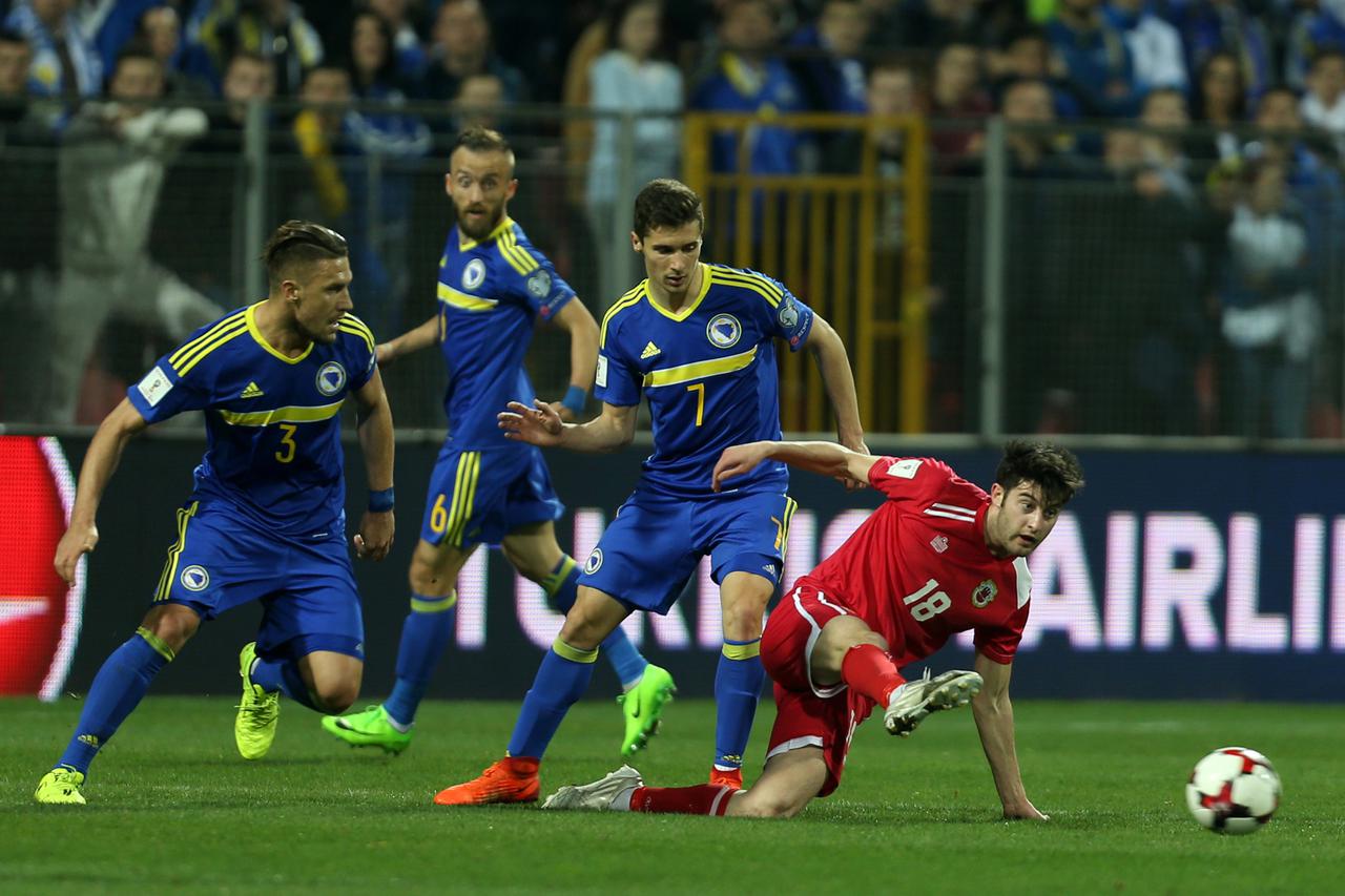 Bosnia and Herzegovina v Gibraltar - 2018 World Cup Football Soccer - Bosnia and Herzegovina v Gibraltar - 2018 World Cup Qualifiers European Zone - Bilino polje, Zenica, Bosnia and Herzegovina - 25/03/17. Bosnia's Gojko Cimirot and Gibraltar's Anthony He