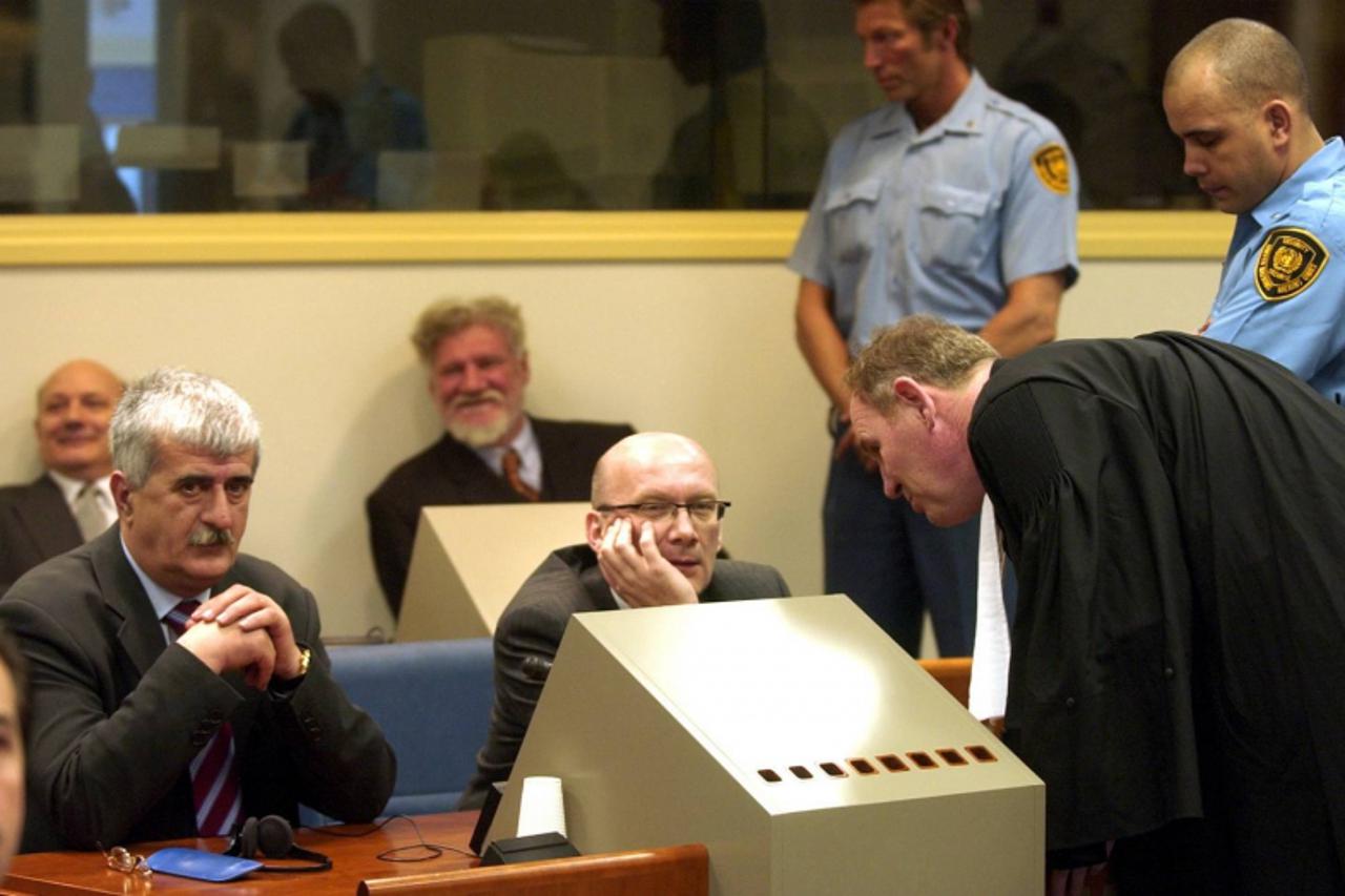 'Ethnic Croats, from left to right back raw, Milivoj Petkovic and Slobodan Praljak, and in front Bruno Stojic and Jadranko Prlic, sit in the Yugoslav war crimes courtroom in The Hague Tuesday April 6,