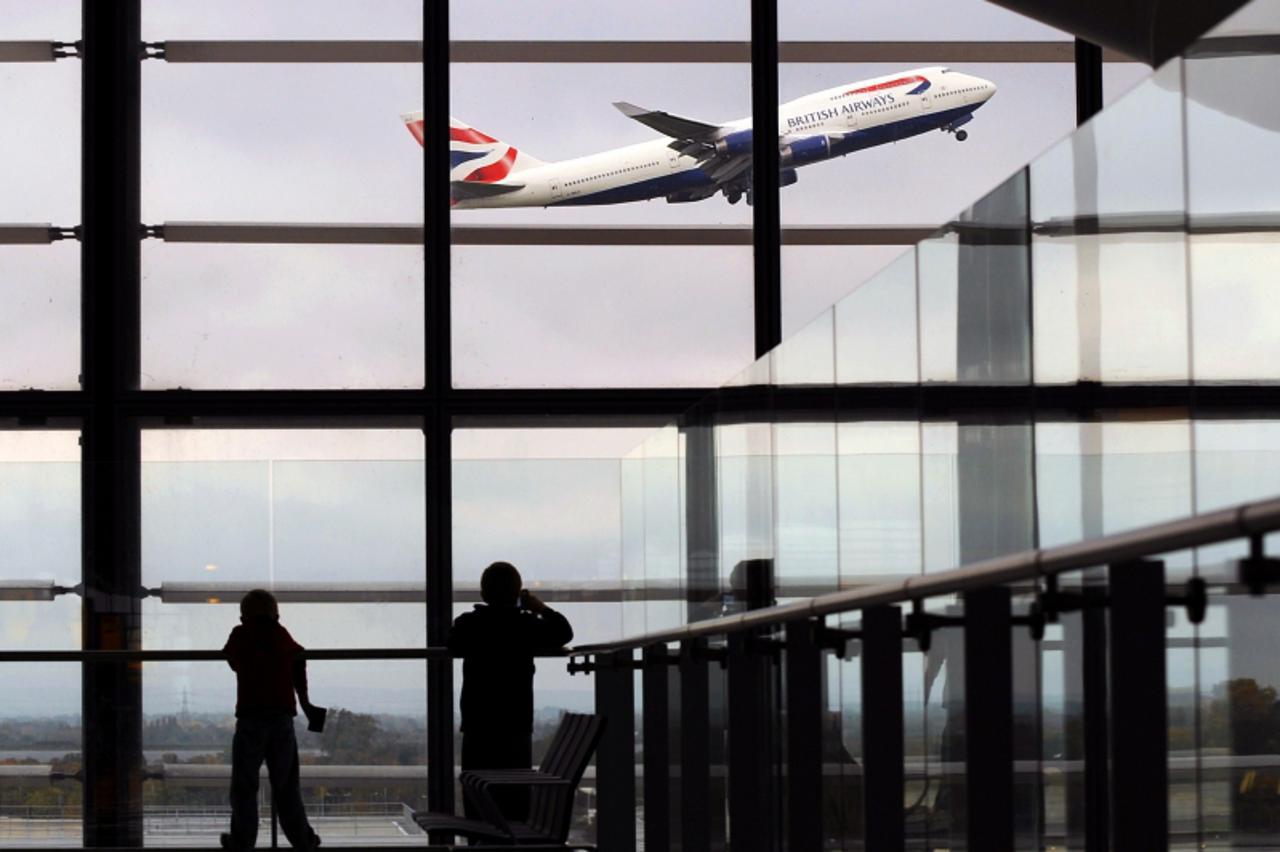 'A British Airways passenger jet takes off from Terminal 5, at Heathrow Airport, west of London, on October 29, 2010.  British Airways on Friday posted net profits of 107 millions pounds for the first