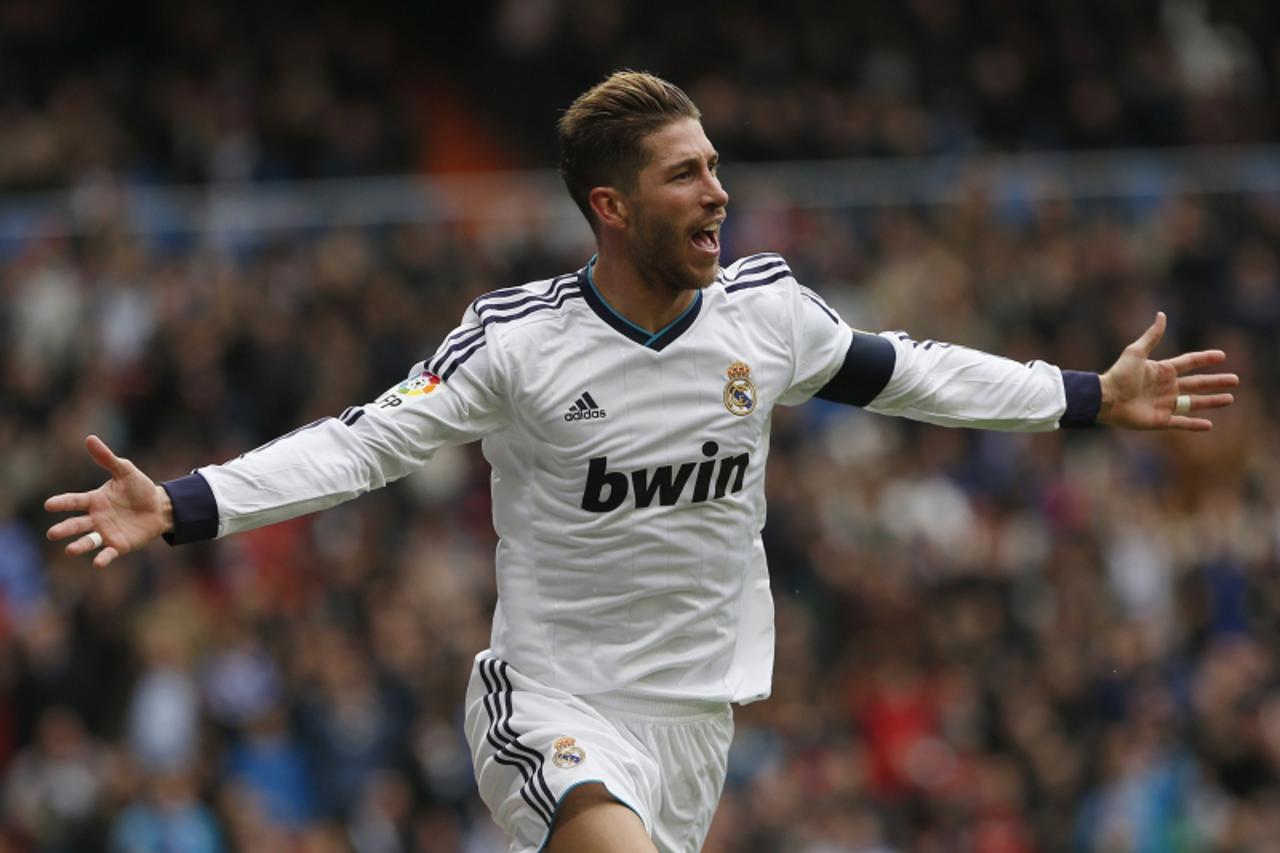 'Real Madrid\'s Sergio Ramos celebrates his goal during their Spanish first division soccer match against Getafe at Santiago Bernabeu stadium in Madrid January 27, 2013. REUTERS/Juan Medina (SPAIN - T