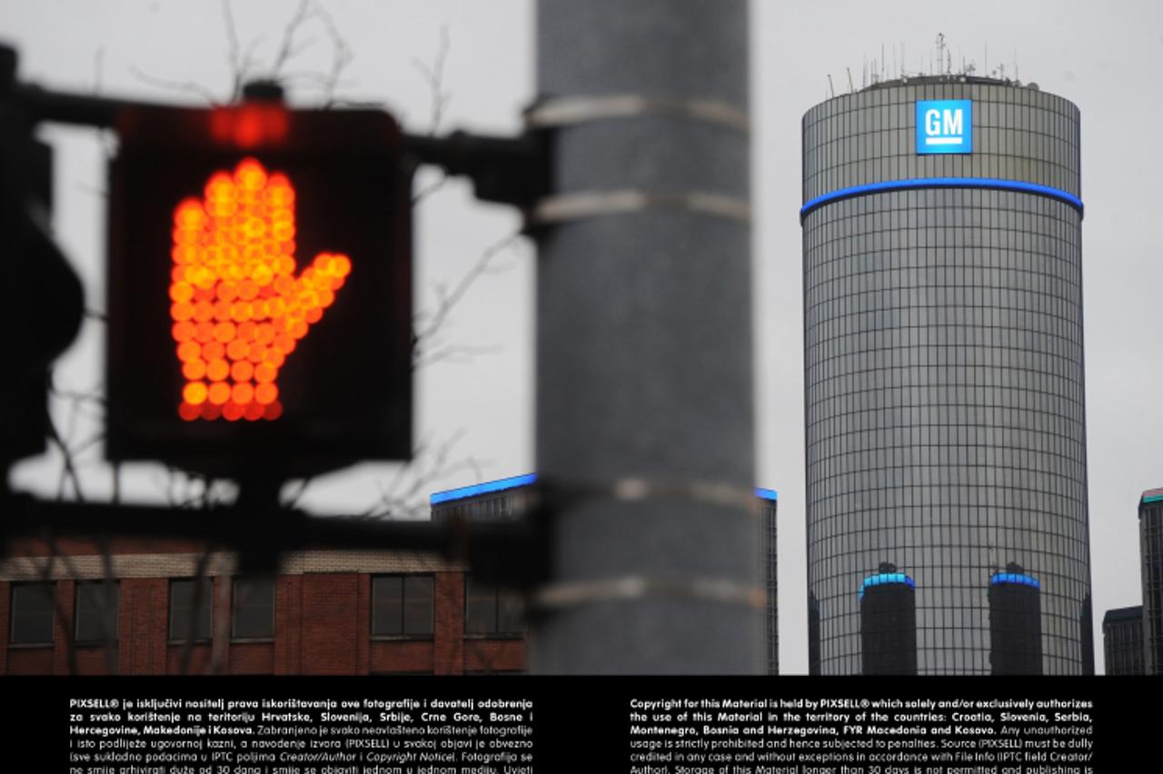 'A pedestrian traffic light indicates red near the headquarter office highrise of US car giant General Motors (GM) in Detroit, USA, 13 January 2013. Photo: Uli Deck/DPA/PIXSELL'