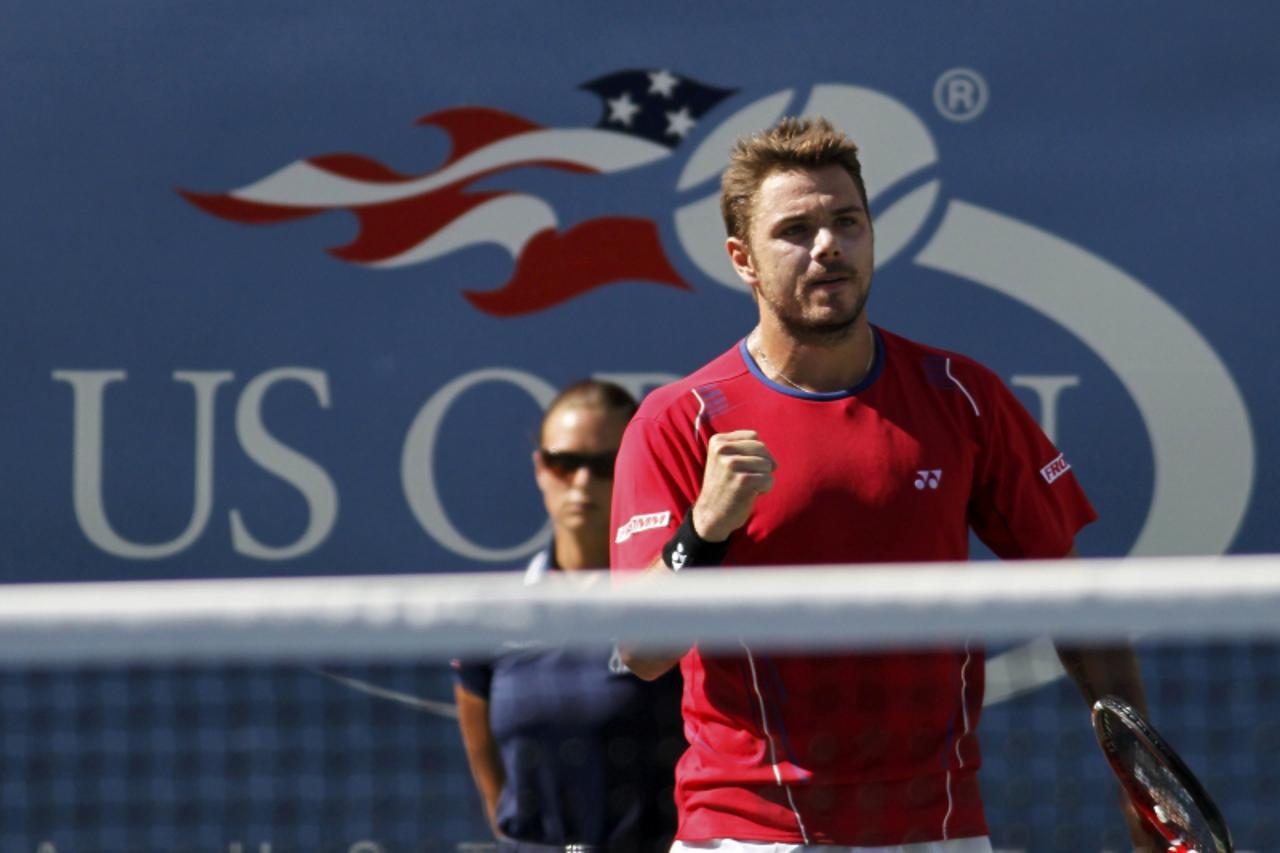 'Stanislas Wawrinka of Switzerland celebrates a point against Andy Murray of Britain at the U.S. Open tennis championships in New York September 5, 2013.     REUTERS/Gary Hershorn (UNITED STATES  - Ta