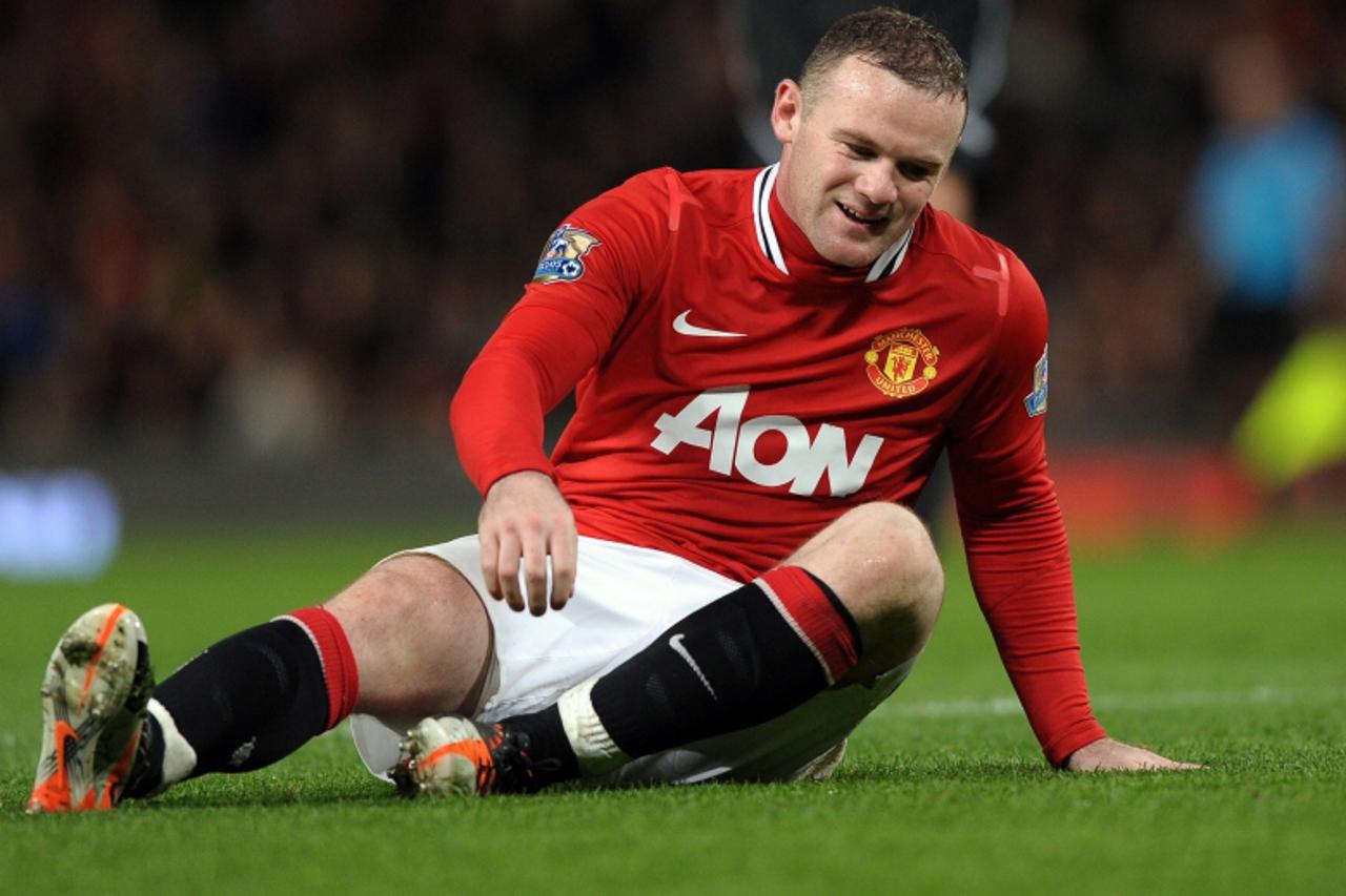 '**CORRECTION TO CAPTION** Manchester United\'s English striker Wayne Rooney reacts after missing a chance during the English Premier League football match between Manchester United and Newcastle Unit