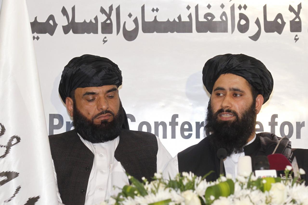 'Muhammad Naeem (R), a spokesman for the Office of the Taliban of Afghanistan speaks during the opening of the Taliban Afghanistan Political Office in Doha June 18, 2013. The Afghan Taliban opened the