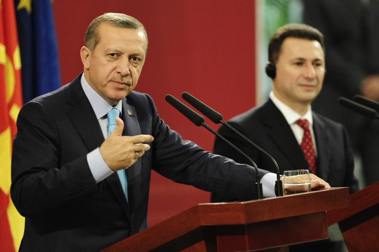 'Turkey\'s Prime Minister Tayyip Erdogan (L) gestures during a news conference with his Macedonian counterpart Nikola Gruevski in Skopje September 29, 2011. Turkey\'s Prime Minister Erdogan is on a tw