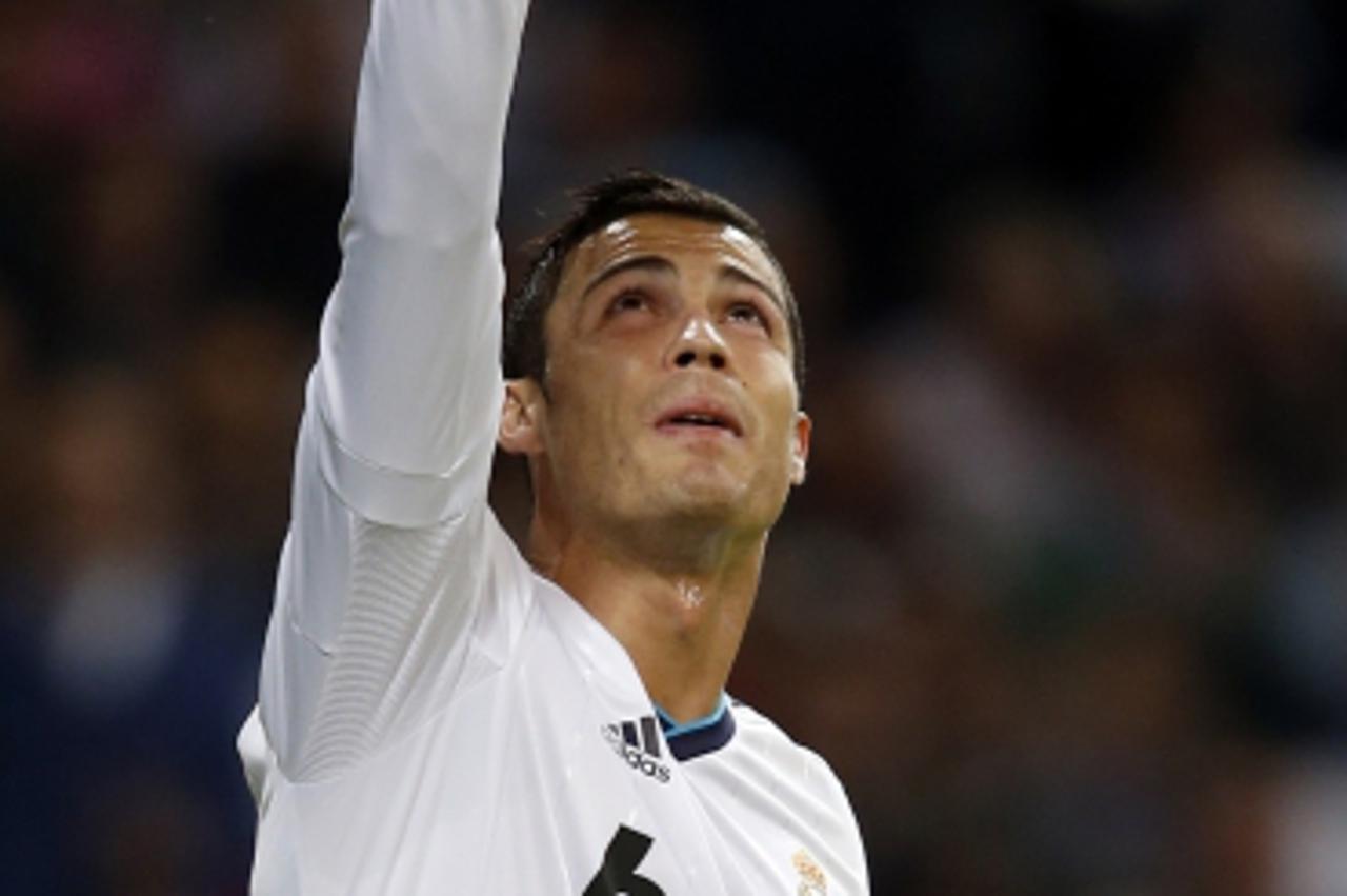 'Real Madrid's Cristiano Ronaldo celebrates after scoring a penalty against Deportivo Coruna during their Spanish first division soccer match at Santiago Bernabeu stadium in Madrid September 30, 2012