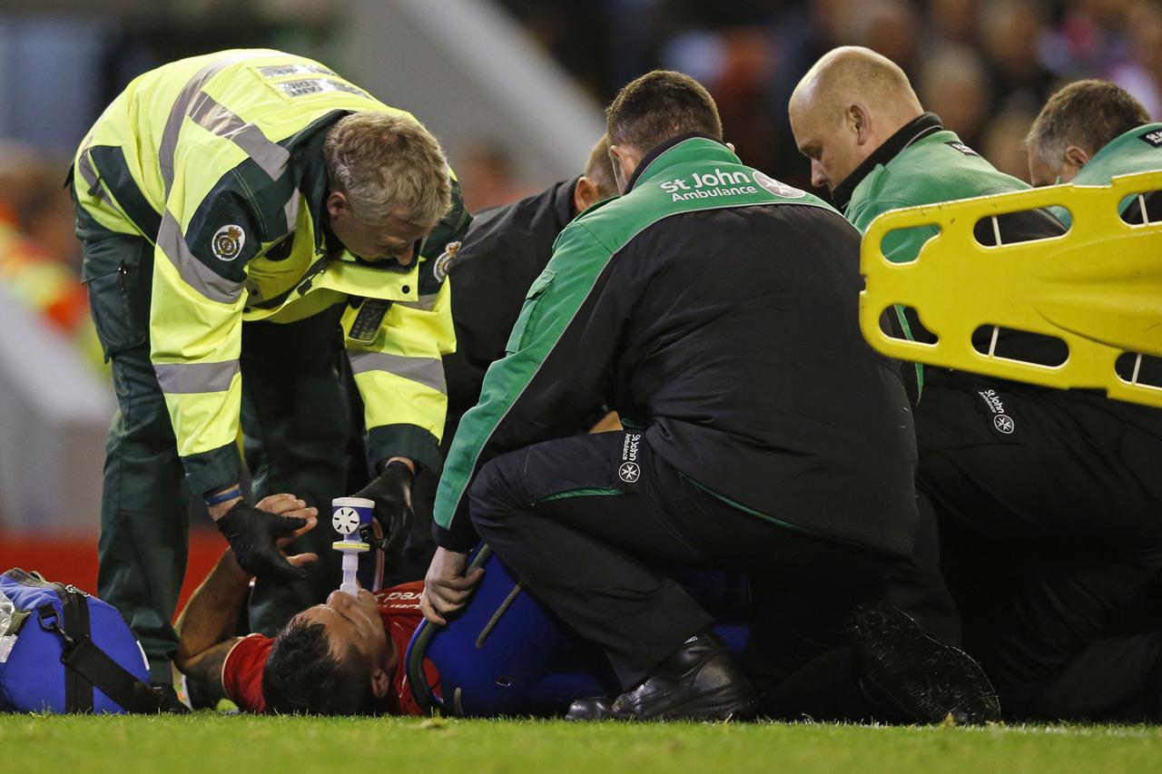 Football - Liverpool v Carlisle United - Capital One Cup Third Round - Anfield - 23/9/15  Liverpool's Dejan Lovren receives treatment after sustaining an injury Reuters / Phil Noble Livepic EDITORIAL USE ONLY. No use with unauthorized audio, video, data, 