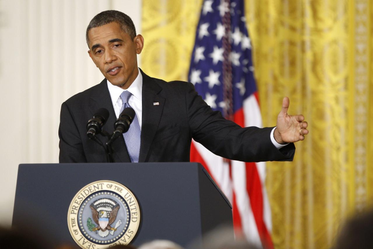 'U.S. President Barack Obama addresses a news conference in the East Room of the White House in Washington, August 9, 2013.  Obama sought on Friday to boost Americans\' confidence in sweeping governme