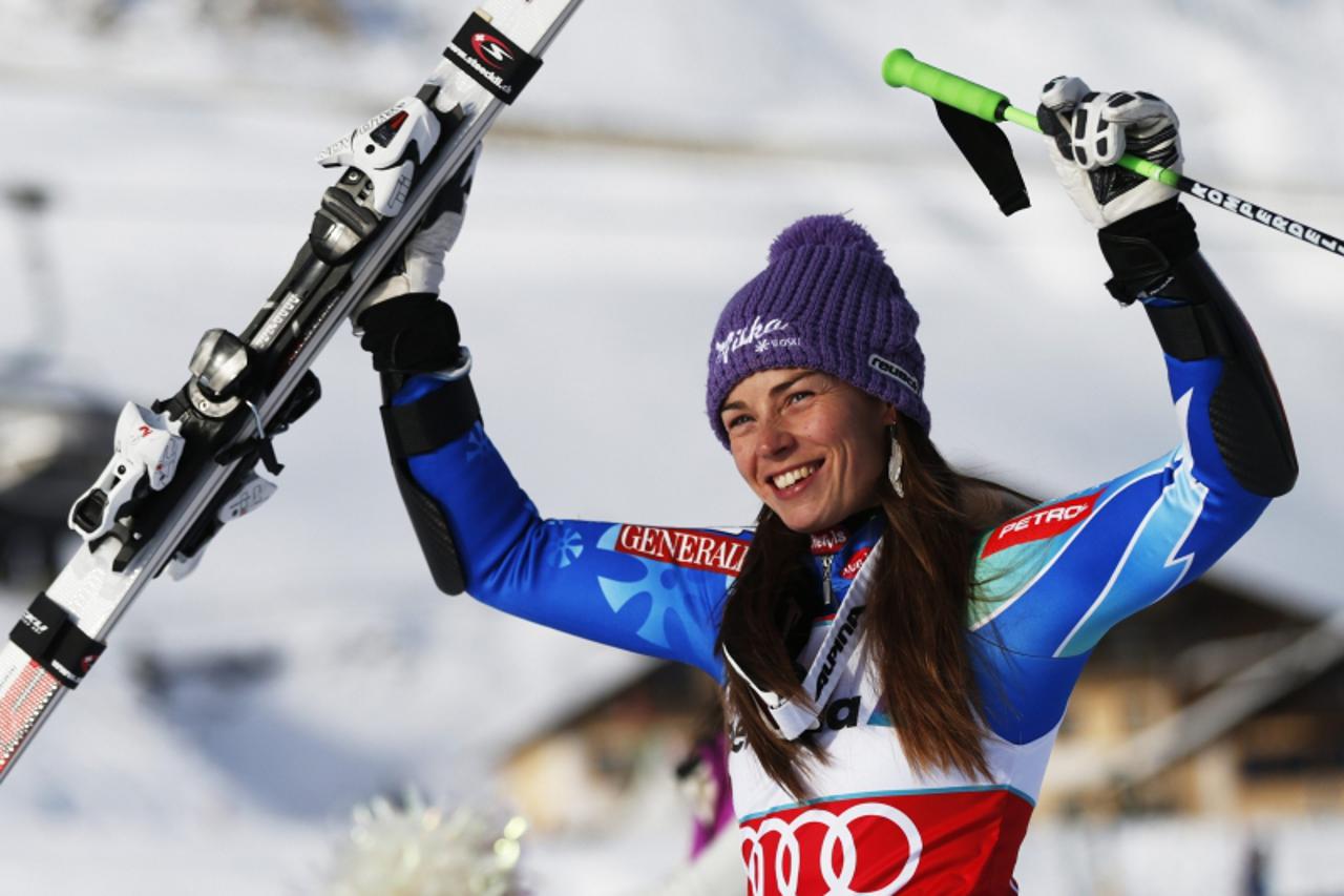 'Winner Tina Maze of Slovenia celebrates after the women's Alpine skiing World Cup giant slalom race at the Corviglia in the Swiss mountain resort of St. Moritz December 9, 2012. Maze won the competi