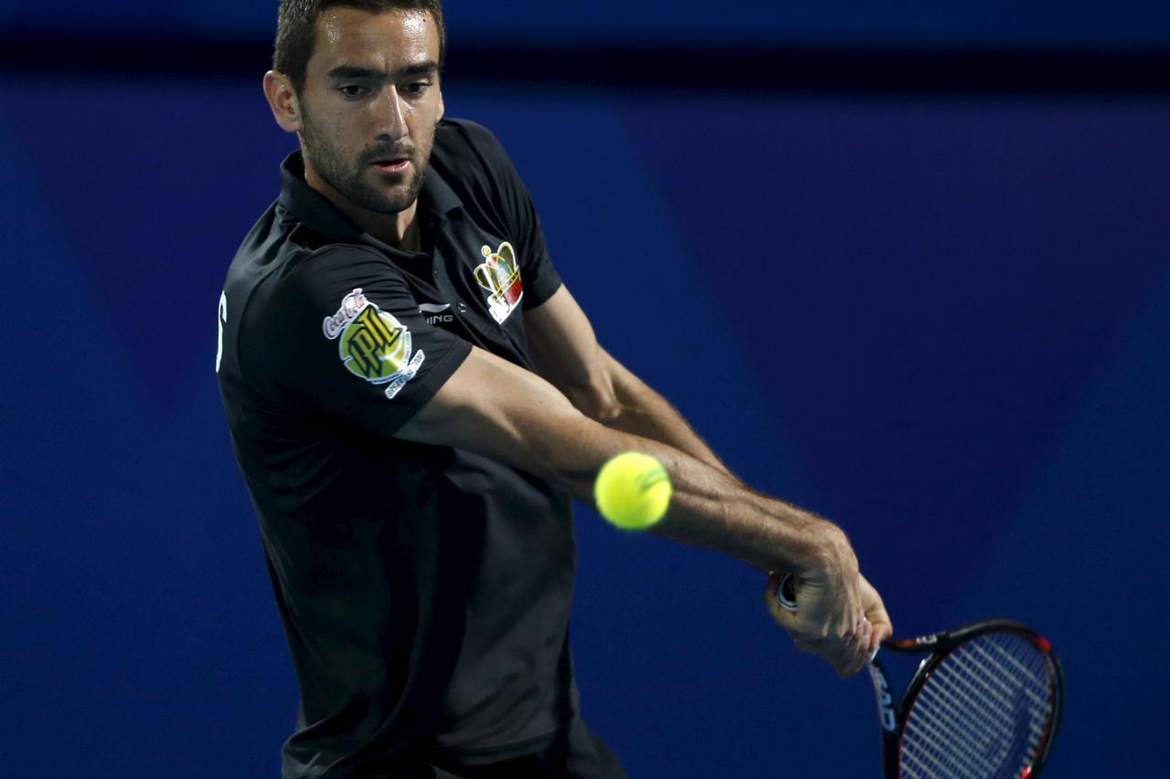 UAE Royals' Marin Cilic hits a return to Legendari Japan Warriors' Philipp Kohlschreiber of Germany during their match at the International Premier Tennis League (IPTL) in Dubai, December 16, 2015. REUTERS/Ahmed Jadallah