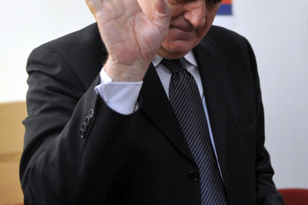'Presidential candidate Tomislav Nikolic, leader of Serbian Progressive Party (SNS), waves to photographers at a polling station on May 20, 2012, in Belgrade. Serbians vote for a new president in a ru