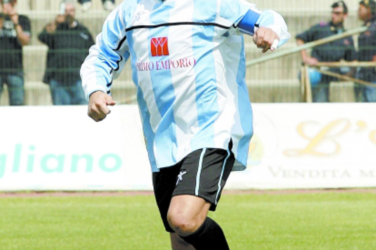 'Argentine football legend Diego Armando Maradona plays at the Giugliano stadium near Naples in a charity soccer game, 07 June 2006. Italian Guardia di Finanza (Economic Police) confiscated 06 June 20