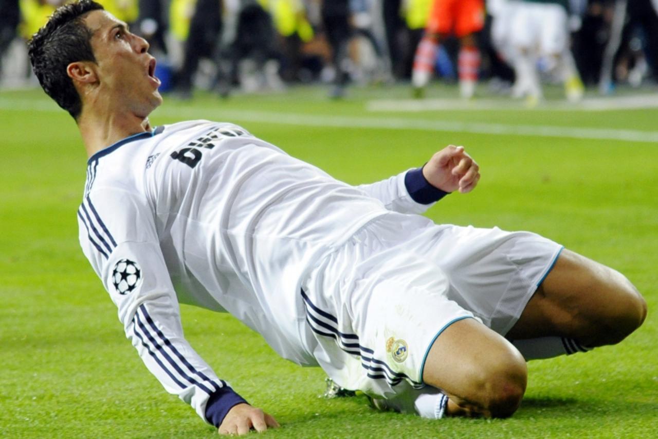 'Real Madrid\'s Cristiano Ronaldo celebrates after scoring a goal against Manchester City during their Champions League Group D soccer match at Santiago Bernabeu stadium in Madrid September 18, 2012. 