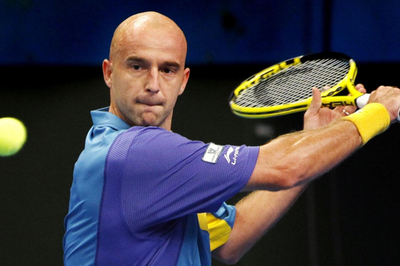 \'Ivan Ljubicic of Croatia hits a return to Arnaud Clement of France during their second round match at the Stockholm Open tennis tournament in Stockholm October 21, 2010.  REUTERS/Bob Strong    (SWED