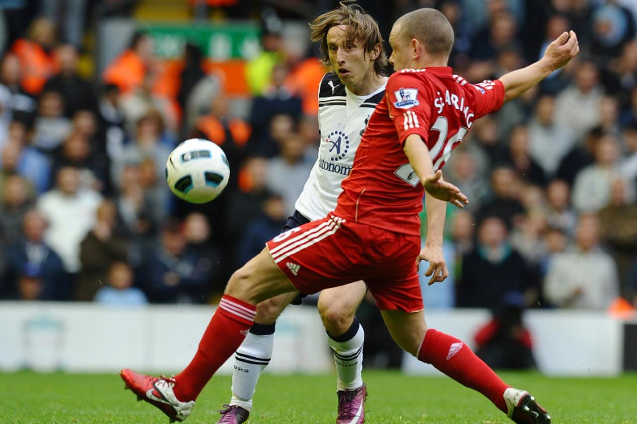\'Tottenham Hotspur\'s French midfielder Luka Modric (L) is challenged by Liverpool\'s English midfielder Jay Spearing during the English Premier League football match between Liverpool and Tottenham 