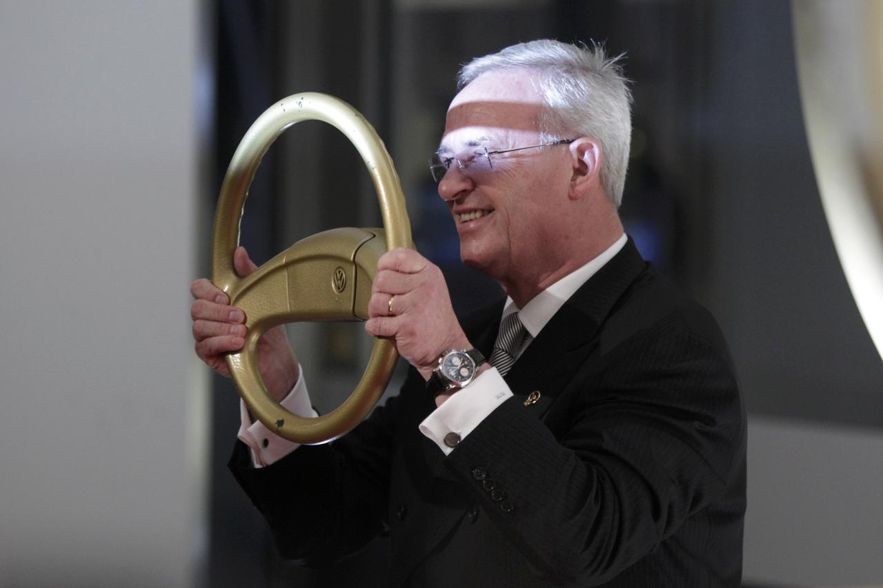 Volkswagen AG's Chief Executive Officer Martin Winterkorn poses for photographers as he arrives for the 