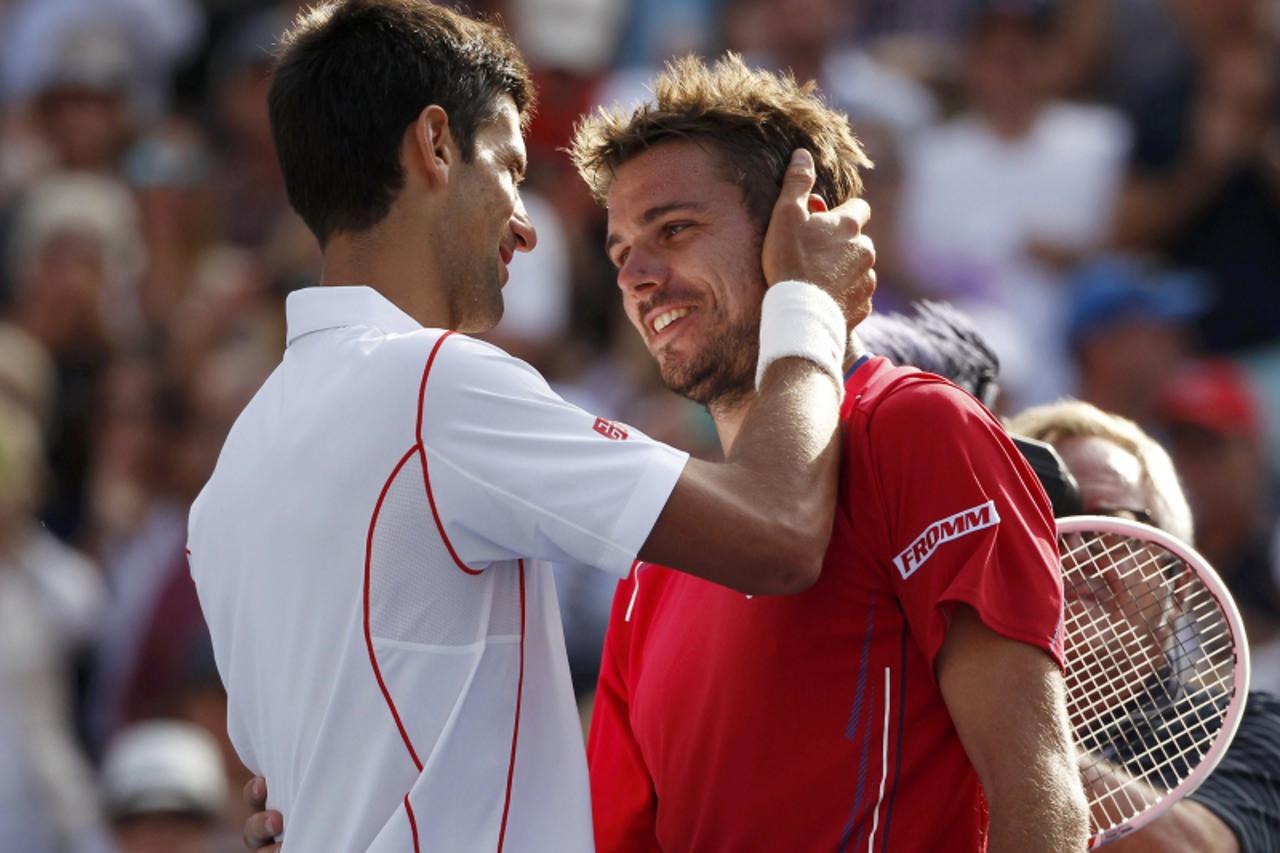'Novak Djokovic of Serbia is congratulated by Stanislas Wawrinka of Switzerland (R) after Djokovic won their men\'s semi-final match at the U.S. Open tennis championships in New York September 7, 2013