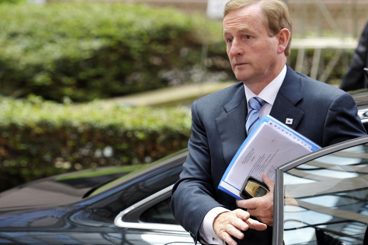 'Ireland's Prime Minister Enda Kenny arrives at the European Council building ahead of an euro zone leaders crisis summit that could lead to a new bailout plan for debt-stricken Greece, in Brussels J