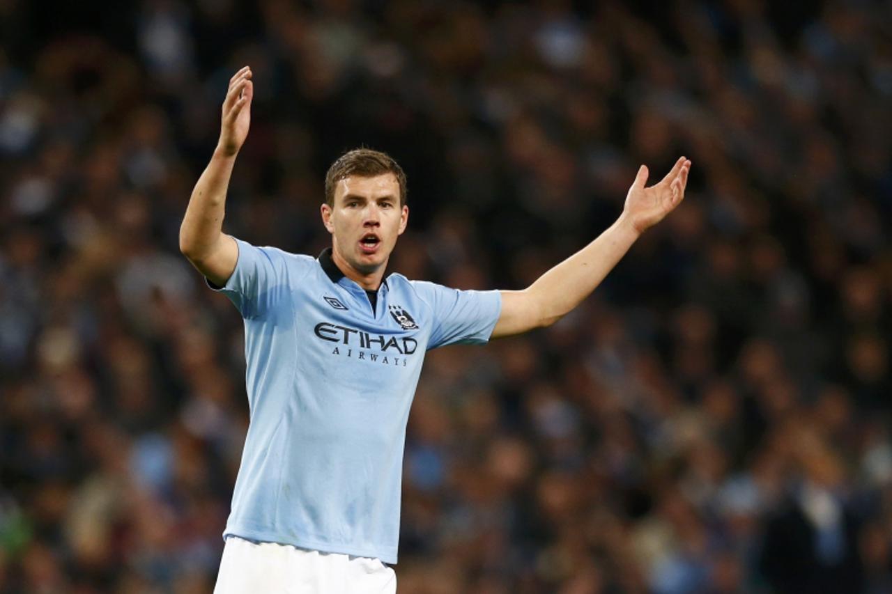 'Manchester City's Edin Dzeko reacts during the Champions League Group D soccer match against Real Madrid at The Etihad Stadium in Manchester, northern England, November 21, 2012.    REUTERS/Darren S