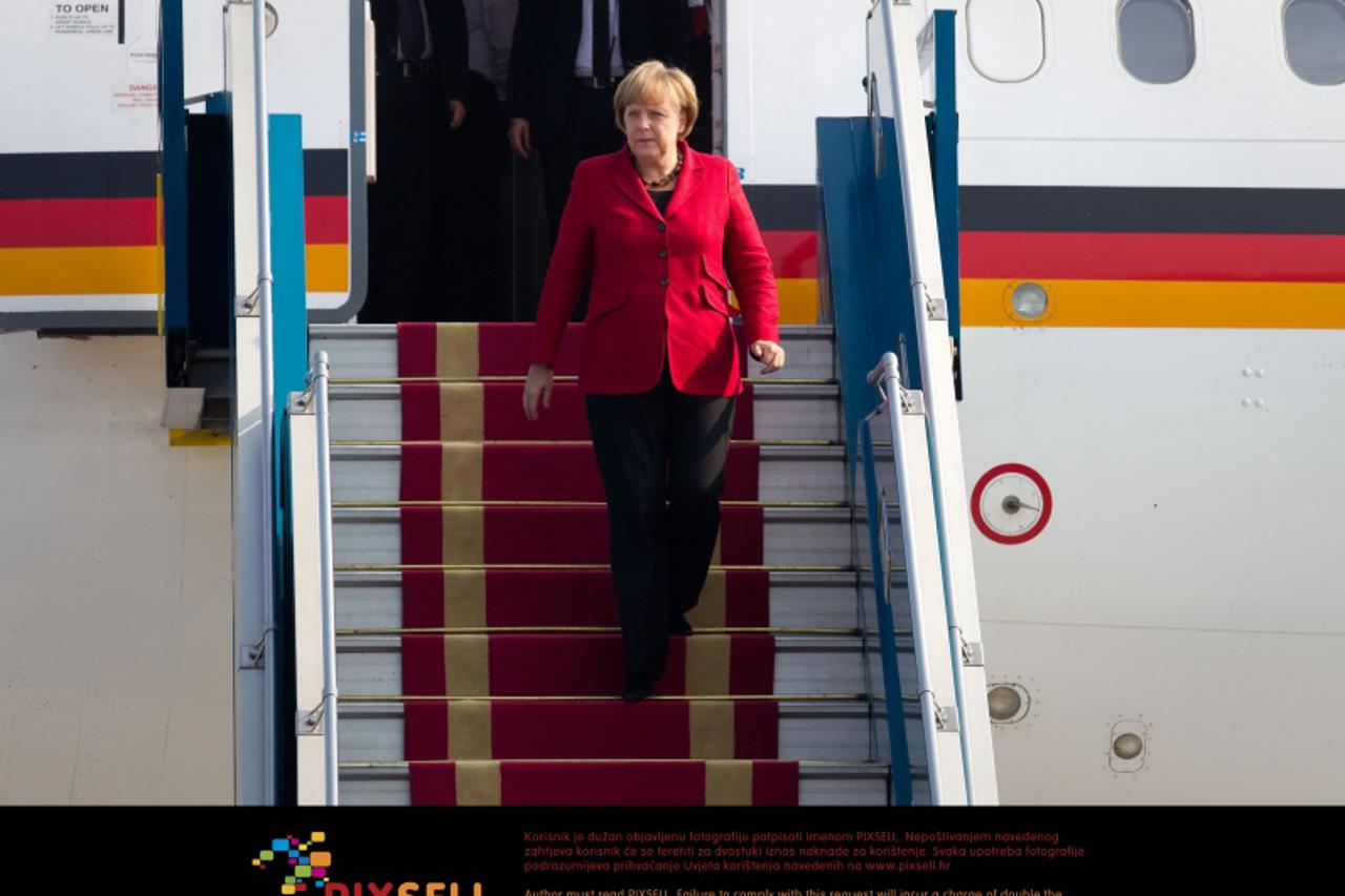 'Chancellor Angela Merkel leaves the governmental aircraft at the airport  Hanoi Noibai in Hanoi, Vietnam, 11 October 2011. Among meeting Prime Minister Tan Dzung Merkel intends to visit economic comp