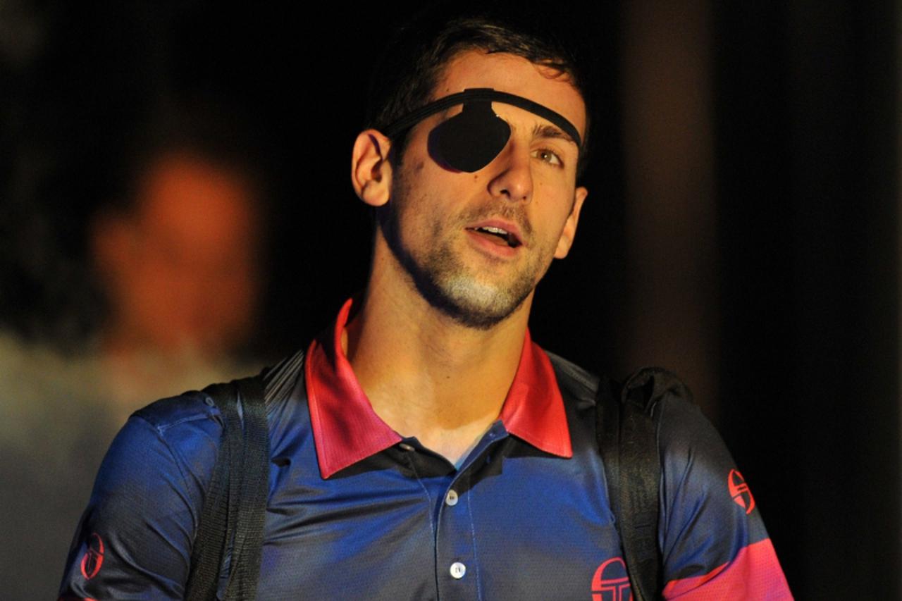'Serbia\'s Novak Djokovic arrives on court to play US player Andy Roddick (not pictured), during their singles tennis match, on the sixth day of the ATP World Tour Finals, at the O2, in south-east Lon