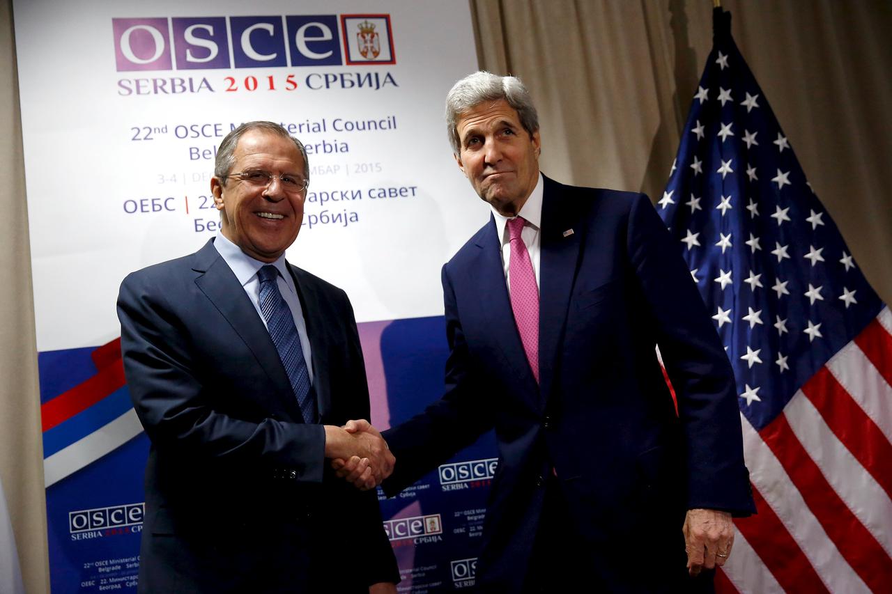 Russian Foreign Minister Sergei Lavrov (L) greets U.S. Secretary of State John Kerry as he arrives for their bilateral alongside the OSCE Ministerial Council meeting in Belgrade, Serbia December 3, 2015. REUTERS/Jonathan Ernst