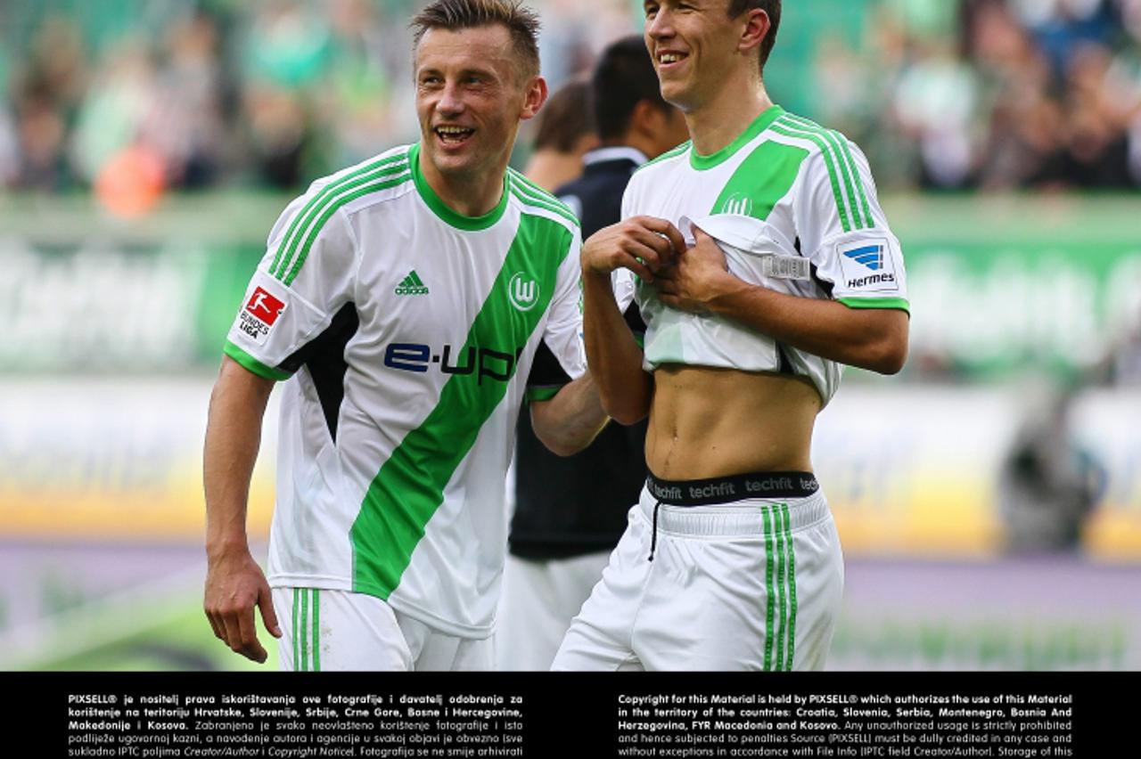 '21.09.2013, Volkswagen Arena, Wolfsburg, GER, 1.FBL, VfL Wolfsburg vs 1899 Hoffenheim, im Bild  Ivica Olic (Wolfsburg #11) und Ivan Perisic (Wolfsburg #9) freuen sich  // during the match from GER, 1