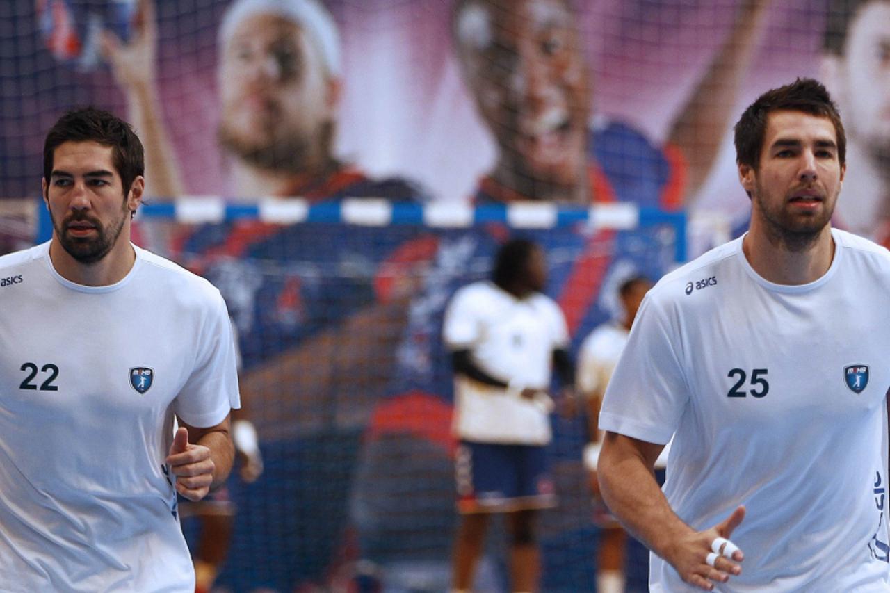 'Montpellier\'s Nikola Karabatic (L) warms-up with his brother and teammate Luka before their team\'s Ligue 1 handball match against Paris Saint Germain in Paris, September 30, 2012. French handball c