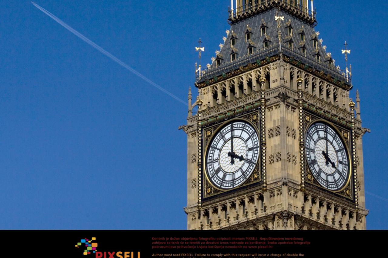 'A plane flies past Big Ben and the Houses of Parliament in London after the UK\'s skies reopened. Photo: Press Association/Pixsell'