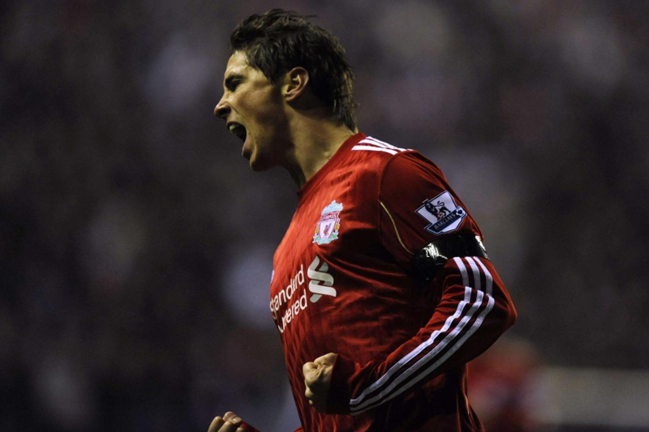 \'Liverpool\'s Fernando Torres celebrates scoring against Wigan Athletic during their English Premier League soccer match in Wigan, northern England in this November 10, 2010 file photo. Chelsea on Ja