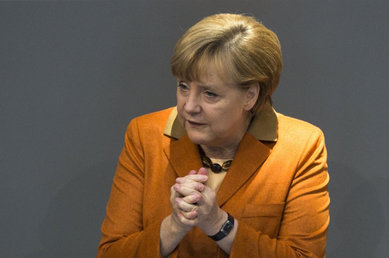 'German Chancellor Angela Merkel delivers a government policy statement during a session of the Bundestag, the German lower house of parliament, in Berlin October 18, 2012.    REUTERS/Thomas Peter (GE