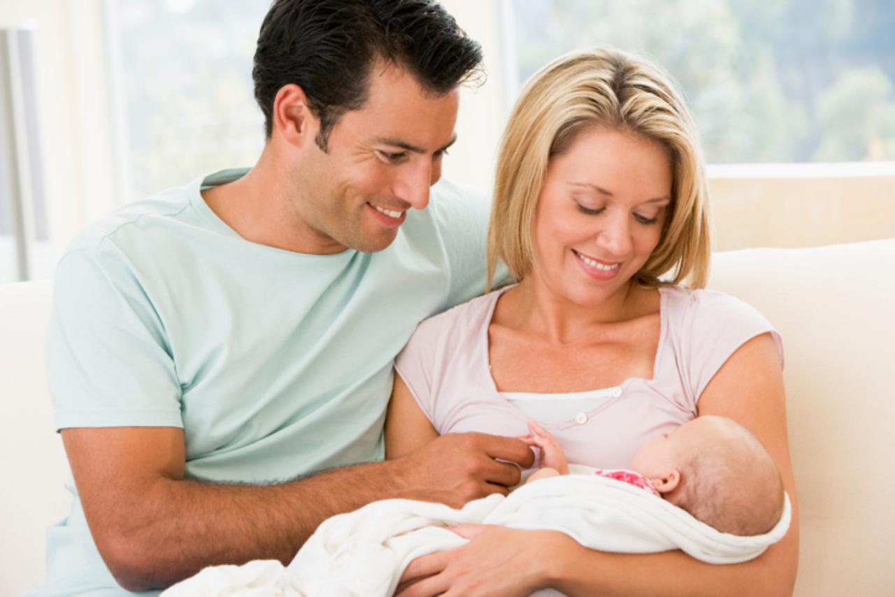 Couple in living room with baby