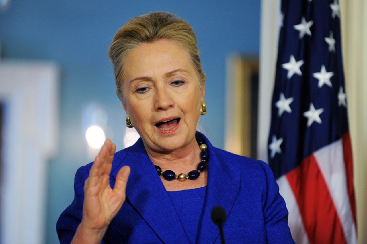 'US Secretary of State Hillary Clinton answers a question during a joint press conference with Brazilian Foreign Minister following their bilateral meeting at the State Department in Washington, DC, o