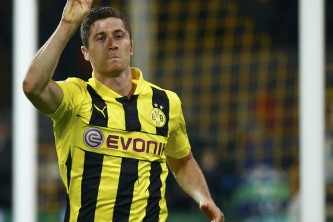 'Borussia Dortmund's Robert Lewandowski gestures as he celebrates after scoring a fourth goal against Real Madrid during their Champions League semi-final first leg soccer match at BVB stadium in Dor