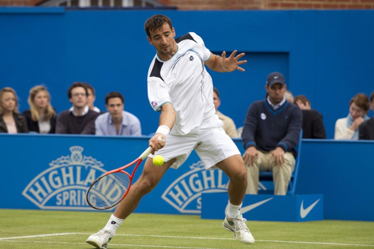 'Croatia\'s Ivan Dodig hits a return against USA\'s Sam Querrey during their quarter-final men\'s singles match on the fifth day of the Aegon Championships tennis tournament at the Queen\'s Club in we