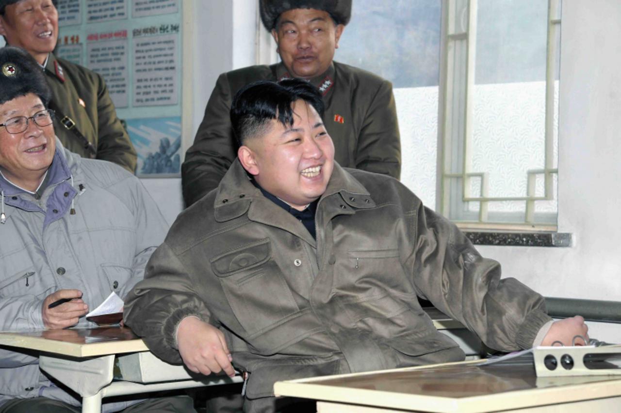 \'Kim Jong-Un (C), supreme commander of the Korean People\'s Army (KPA) and supreme leader of the Workers\' Party of Korea, state and army, visits the KPA Unit 169 in this file photo released by North