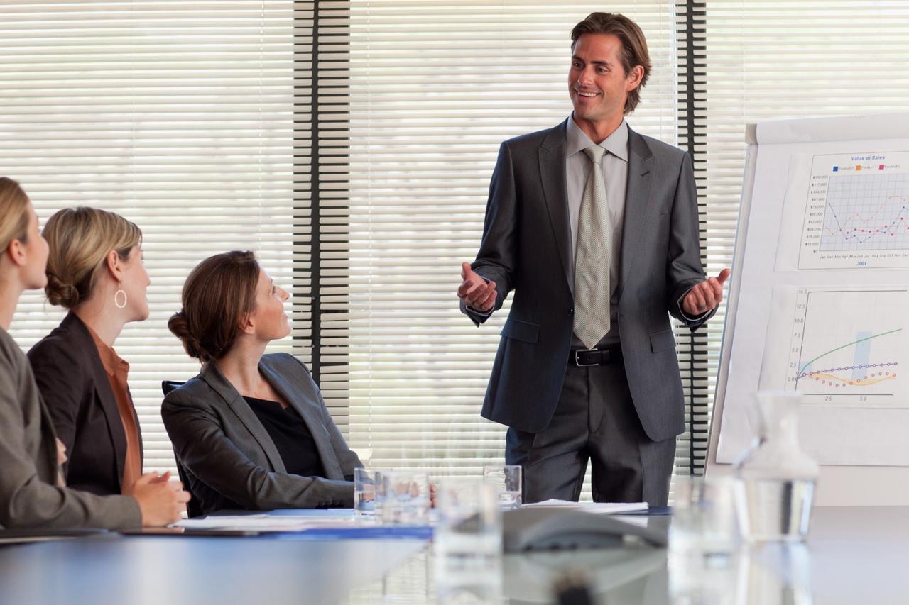Businessman leading meeting in conference room