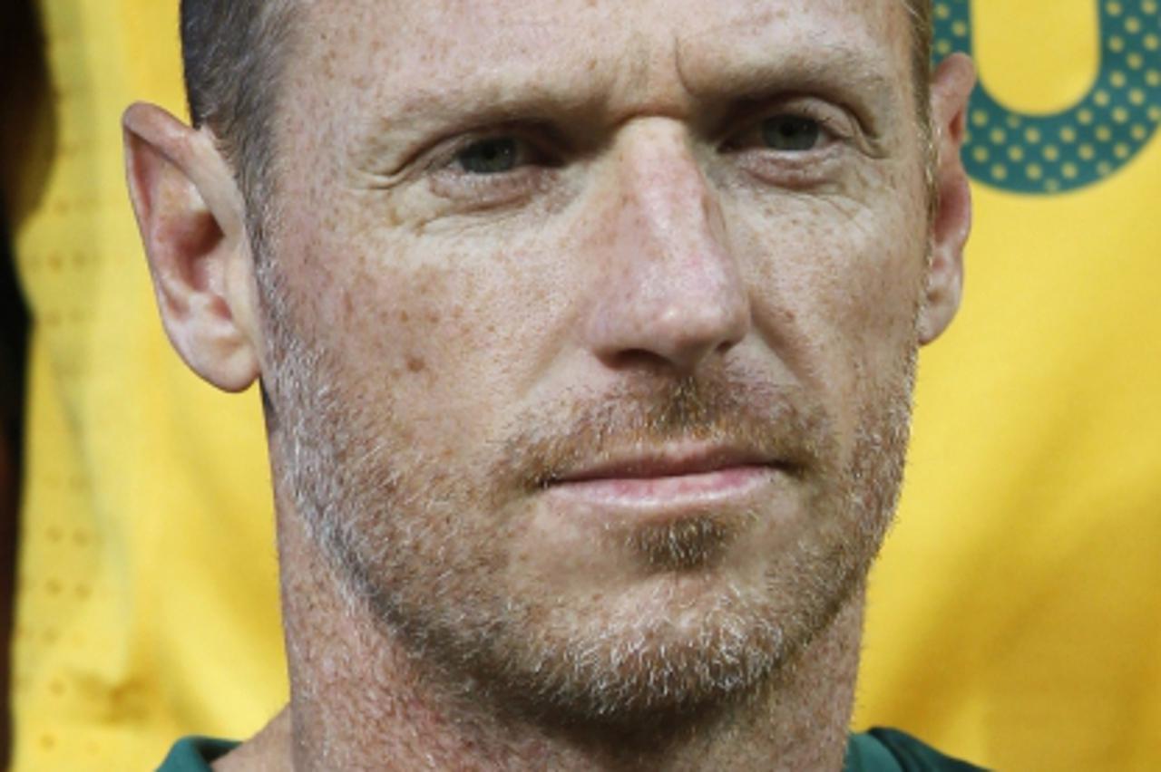 \'Australia\'s Craig Moore attends a team training session in Melbourne in this May 19, 2010 file photo. The former Australia defender faces a court hearing in Dubai after being arrested on a drinking