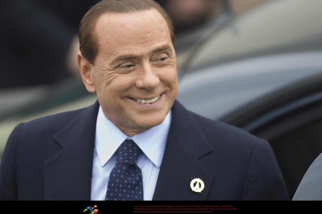 'Silvio Berlusconi, Italy\'s prime minister, arrives for an evening dinner function at the G8 summit in Deauville, France. Photo: Press Association/Pixsell'